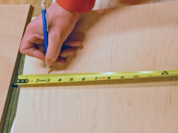 Use a tape measure to determine range hood's desired height, width and depth — be sure to take into account the size of exhaust fan, placement of vent to roof or exterior wall, and size of liner if one is being used. Measure exhaust fan and transfer measurements to piece cut for bottom, marking those with a pencil