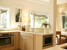 White Contemporary Kitchen With Blonde Wood Cabinets