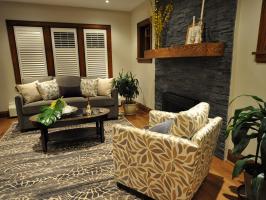 Charcoal Living Room With Stone Fireplace