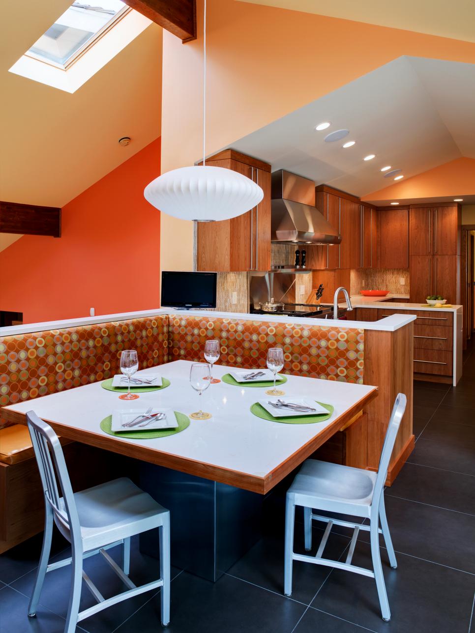 Yellow & Orange Eat-In Kitchen With Dotted Banquette, White Pendant