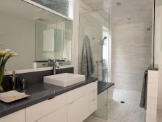 Modern White Bathroom With Dark Gray Accents and Vessel Sink