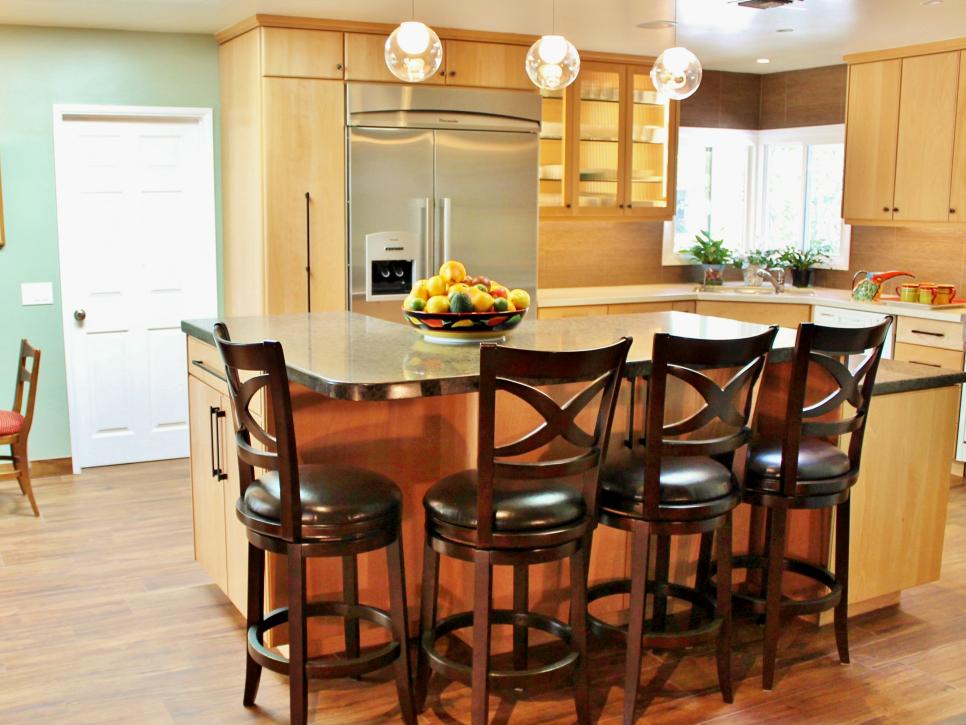Dark Wood Barstools in Contemporary Kitchen With Light Wood Cabinetry