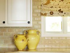 Floral Window Shade and Tile Backsplash in Pale Yellow Kitchen