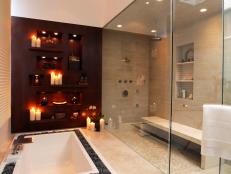 Designer Christopher Grubb created a modern bathroom that features a large walk-in shower, sunken tub and double vanity.