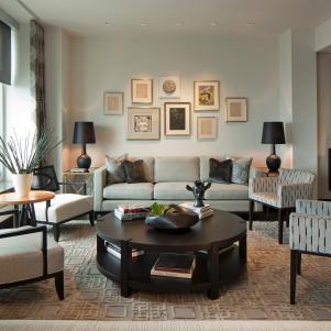 Living Room With Gallery Wall, Contemporary Gray Chairs and Round Table