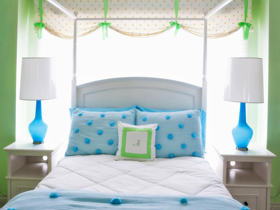 Green Eclectic Kid's Room With Blue Lamps and Bed Linens