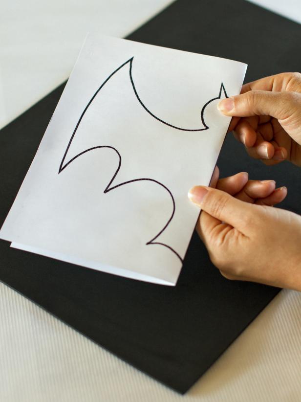 Print out a bat template and fold in half, then cut out.