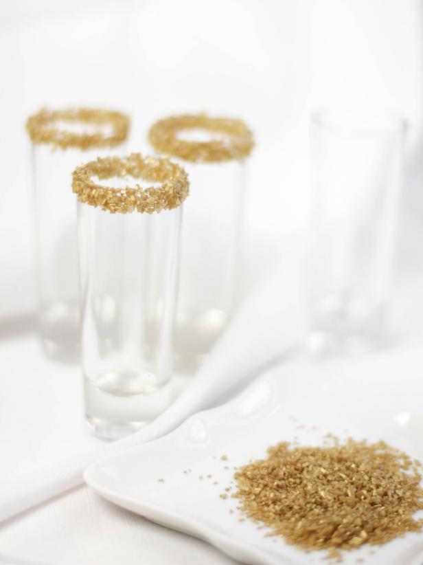 Lightly dip the rims of the glasses into corn syrup, then into the sugar. Let sugar-rimmed glasses stand at room temperature.