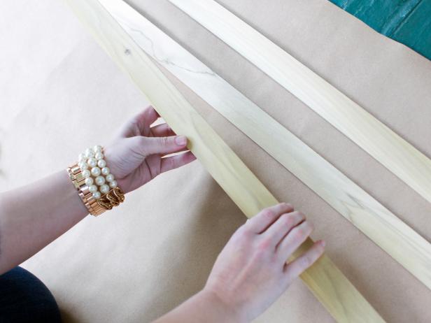 Use a tape measure to determine the proper width of the covered porch intended for covering, as well as the proper height for each section of drapery. Cut wood strips to fit the size drape you want.