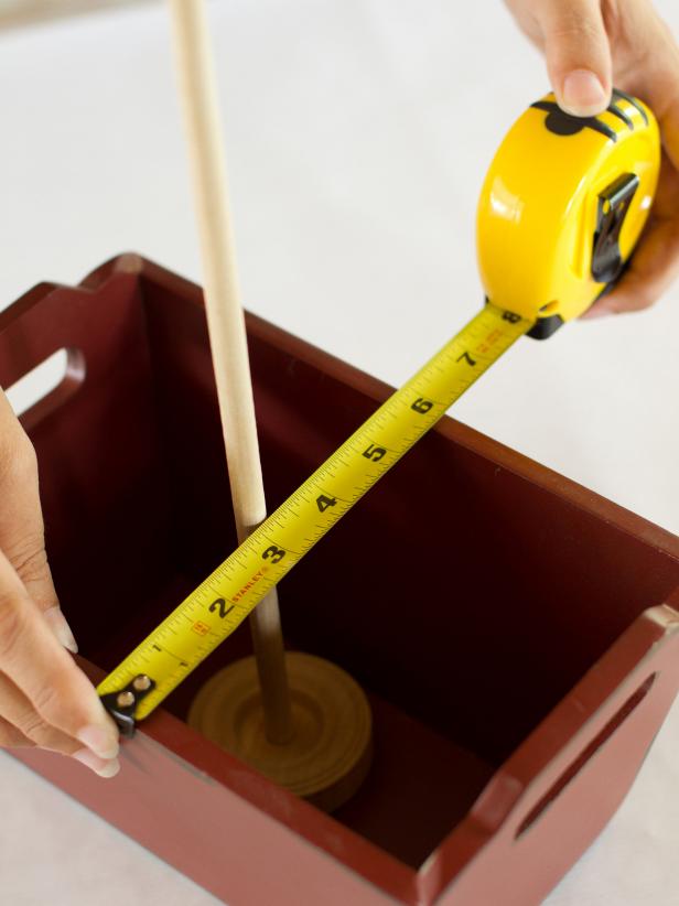 Place the tread wheel and dowel in the center of the serving container and measure the container's width.