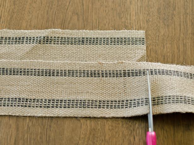 Spread a length of upholstery webbing over table to determine desired width of runner. Line up all lengths of upholstery webbing. Run another piece of webbing across length for the width and cut to size with sharp scissors — no excess overhang is necessary. Repeat this process until entire width of runner is covered