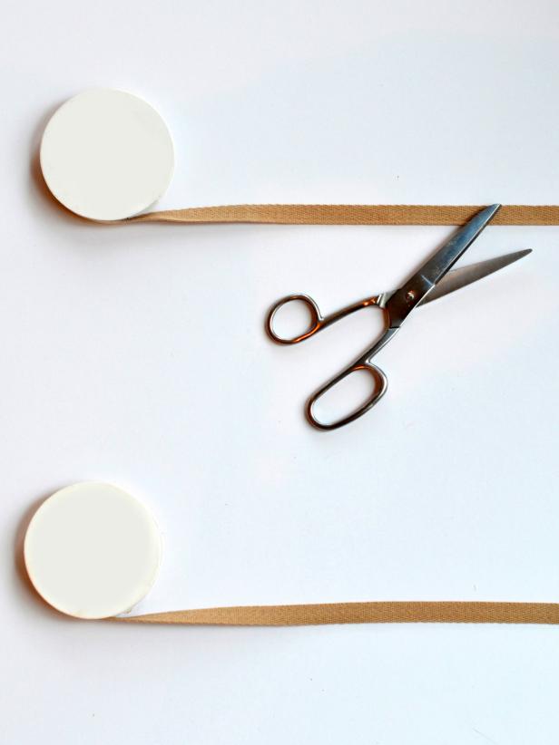 Ribbon will form the base of the runner; measure your table and decide how long of a runner you need then cut two pieces of ribbon to desired length.