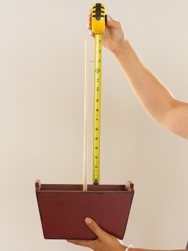 Measure the distance from the top of the centerpiece container to the top of the dowel.