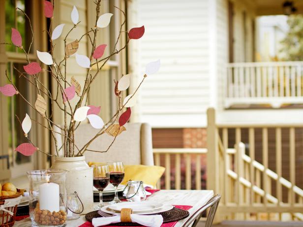Looking for an inexpensive, eye-catching centerpiece that will last all season long? All you need is some patterned scrapbook paper, twine, glitter spray and a handful of branches to create a fabulous focal point on your table this fall.
