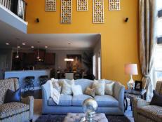 Yellow Living Room With High Ceilings