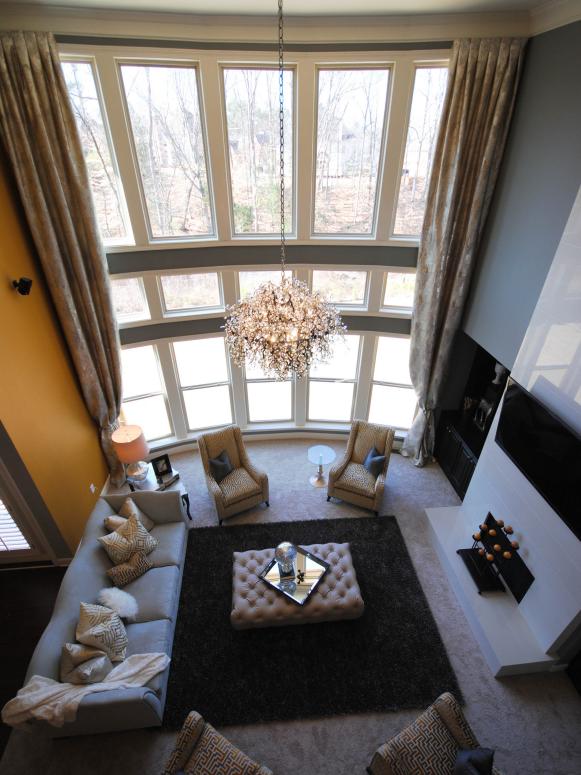 Transitional Gray Living Room With Two-Story Windows Transitional Gray Living Room With Two-Story Windows