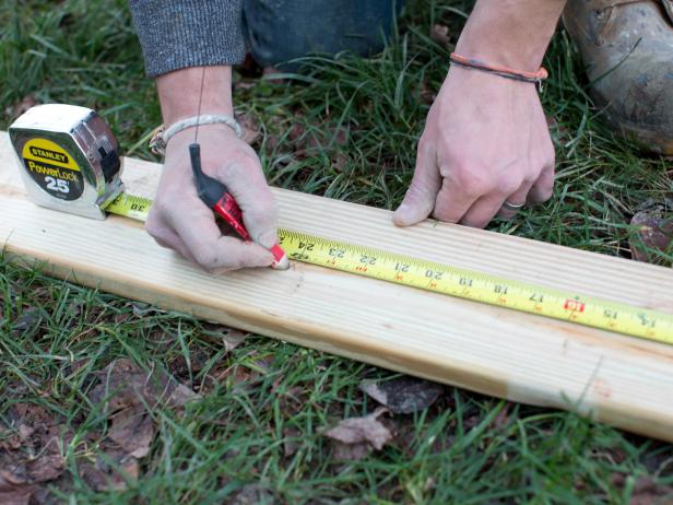 Using measuring tape and pencil, mark 2x4 pine planks to standard seat width which is 18-20 inches. Cut swing seat to size using circular saw.