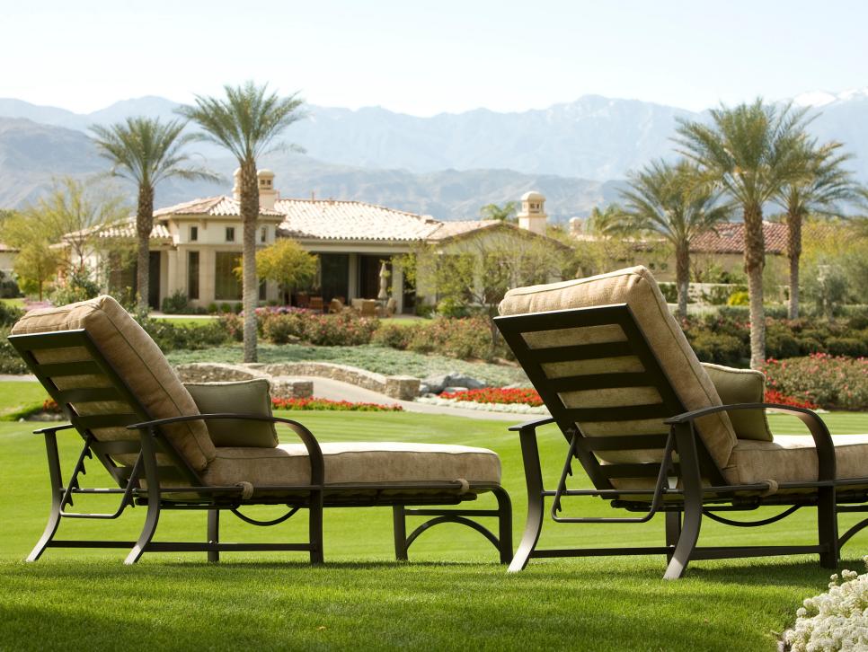Two Outdoor Chaise Lounges on Manicured Lawn