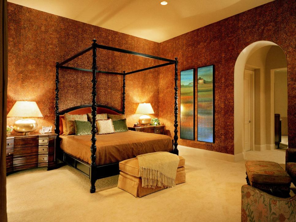 Master Bedroom With Black Canopy Bed and Red Patterned Wallpaper