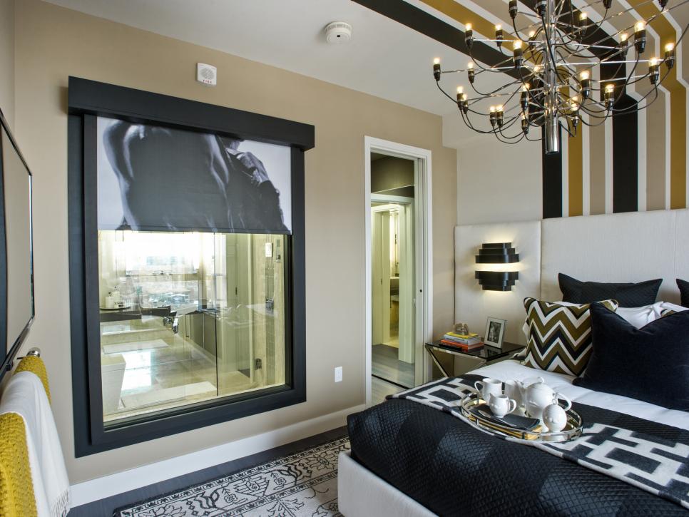 Contemporary Master Bedroom with Modern Chandelier and Large Window