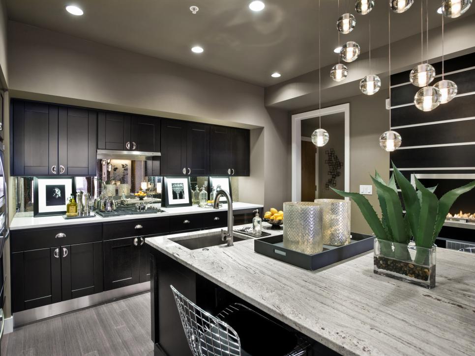 Kitchen With Black Cabinets, Gray Bamboo Floor and Large Island