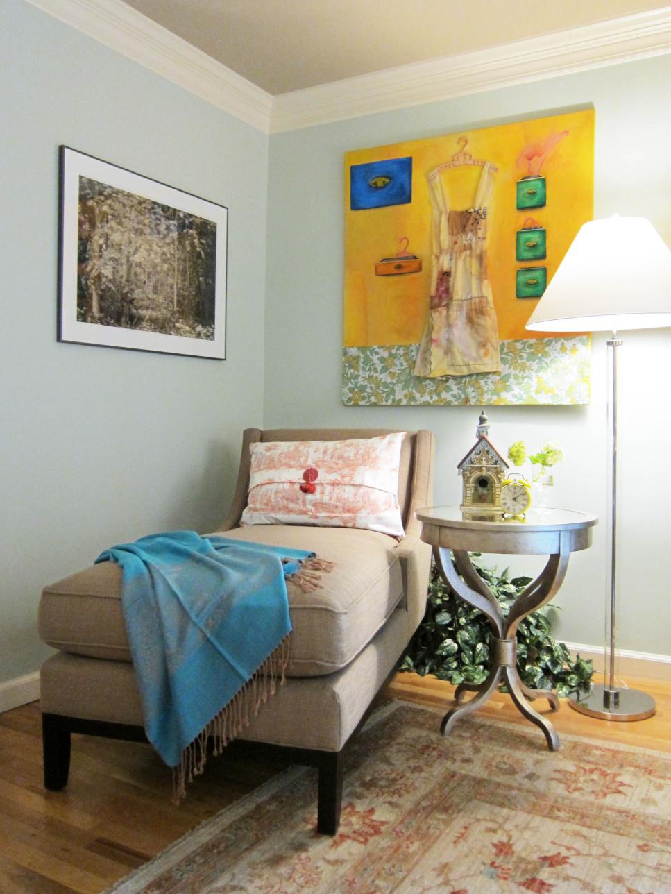 Light Blue Sitting Area With Neutral Chaise and Colorful Art