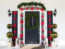 Create a classic holiday entrance using greenery and all natural materials to dress up your front porch.
