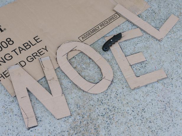 For an extra layer of decoration, consider adding words to your tree silhouette by tracing letters or numbers directly to cardboard, cutting with a box cutter, then tracing directly to plywood. Add penny nails to traced outline with hammer.
