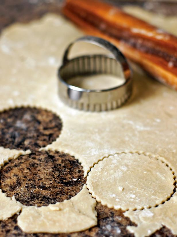 Roll out pie crust to about 1/4 inch thickness on a flat surface lightly dusted with flour. With a circular cookie cutter (3 inch works best), cut out circles from the pie crust dough.