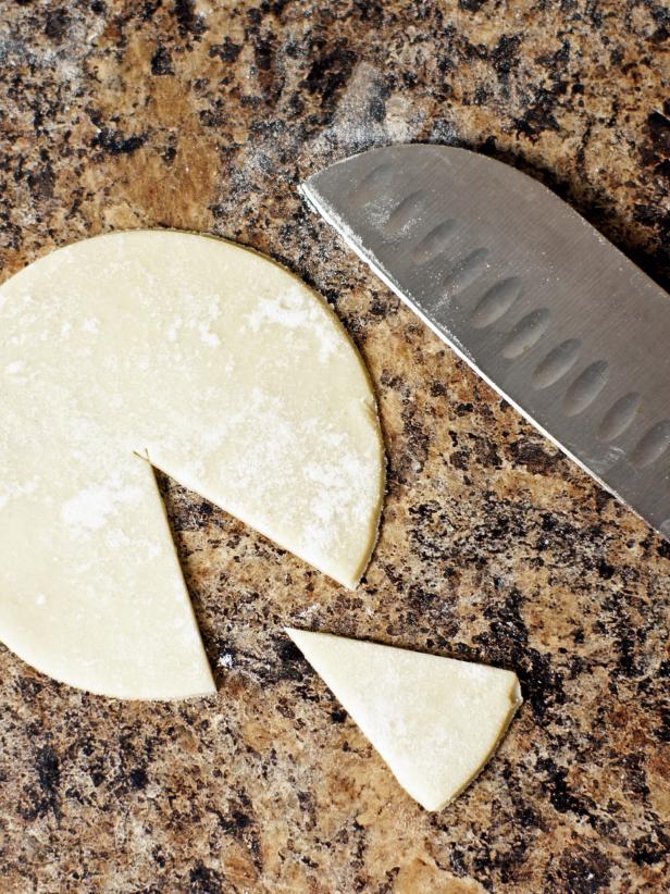 Cut a wedge from each circle of dough to make it easier to insert into each mini muffin pan. Press each pie crust circle into the mini muffin pan and overlap the edges of the wedge you cut out. Press to seal.
