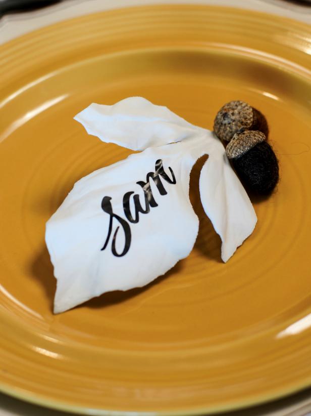 Coat silk leaves in budget-friendly plaster of Paris to create sleek, porcelain-look-alike place cards for your Thanksgiving table.