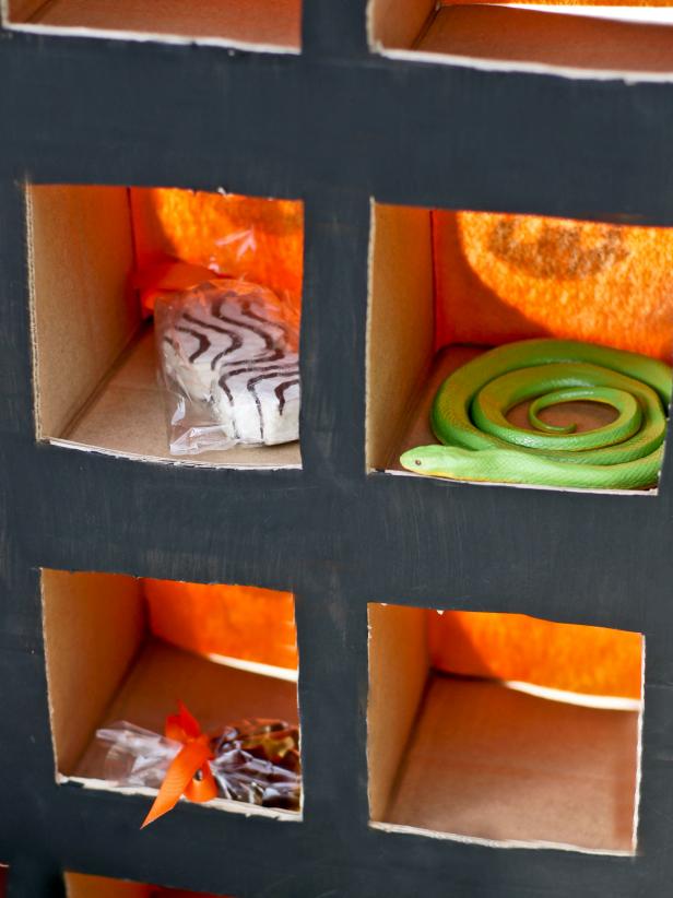 When all boxes have been secured, close up the TV box flaps and secure with duct tape. Load prizes through the back of the game.