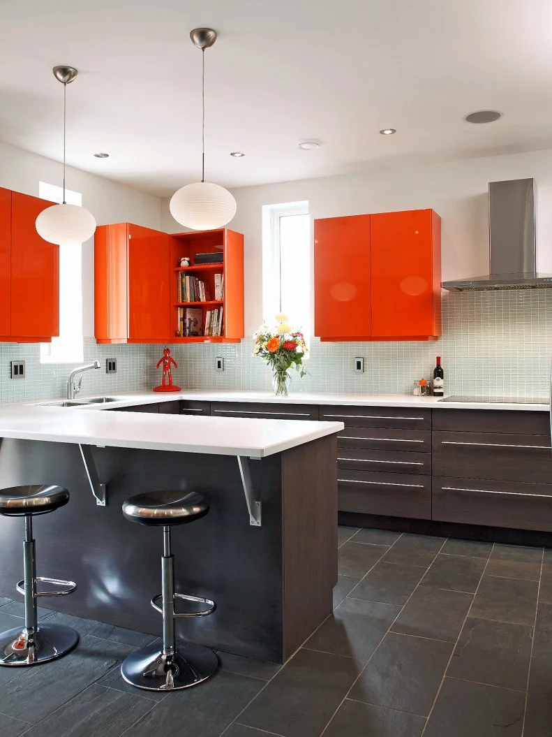 Mod White Kitchen With Orange Upper Cabinets and Brown Lower Cabinets