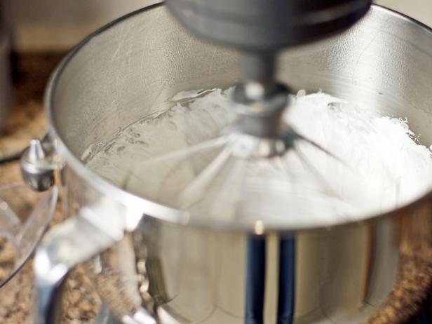 In step 4 of this recipe, with the whisk attachment, beat the mixture on high speed until white, thick and more than double its original volume (6-8 minutes). In a separate bowl beat egg whites to stiff peaks.
