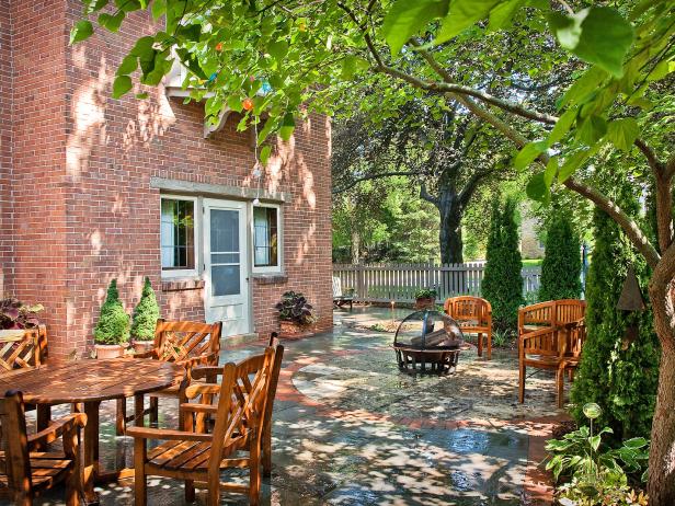 Terrace with wooden chairs and table.