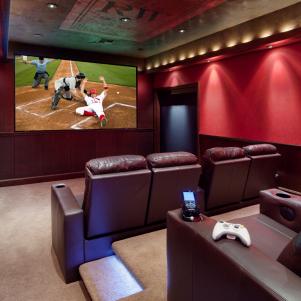 Red Home Theater With Leather Seats and Theater-Style Lights
