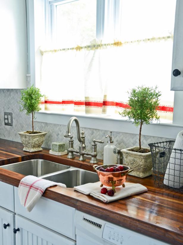 Kitchen Sink With White Cafe Curtain and Butcher Block Counter