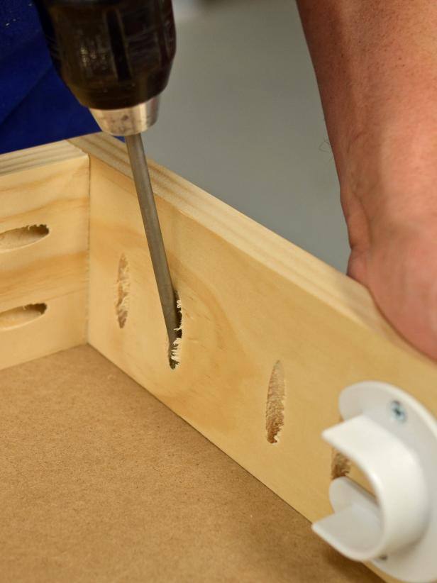 Use 1 1/4-inch wood screws to attach front to top and sides through pocket holes. Place a pair of screws about 2 inches apart every 8 inches for stability. Tip: Wood pieces can be nailed and glued together or screwed directly through one piece into another if a pocket-hole jig isn't available.