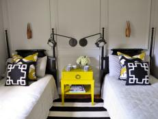 Black and Yellow Guest Bedroom With Two Twin Beds
