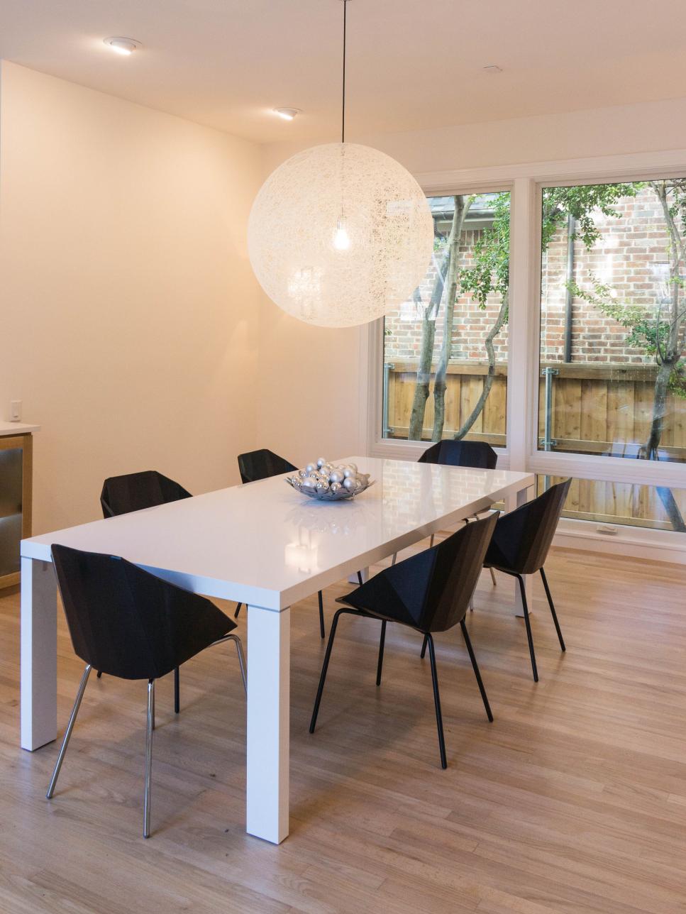Modern Black and White Dining Room with Large Pendant Light Modern Black and White Dining Room with Large Pendant Light