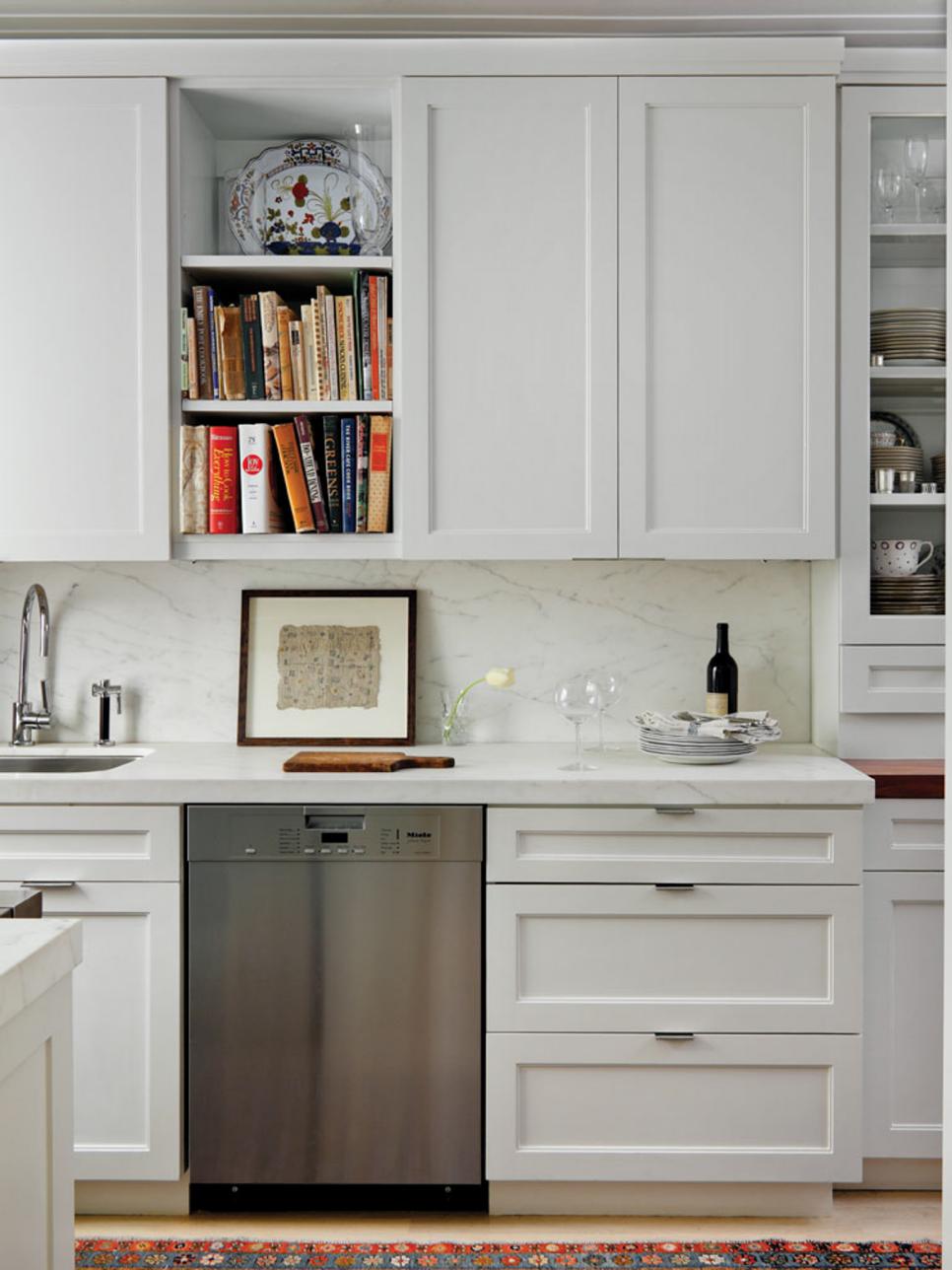Kitchen With Tall White Cabinets, Built-In Shelves & Marble Backsplash