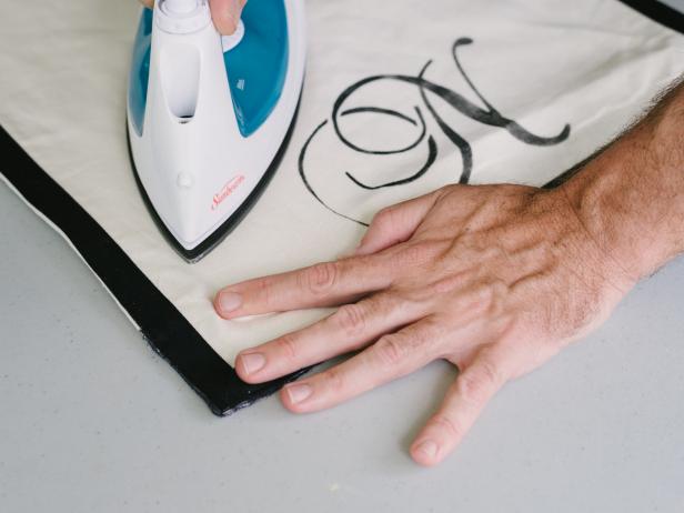After the stencil has thoroughly dried, remove any wrinkles from the runner using iron. Once ironed, your runner is ready to be displayed on the table all season long.