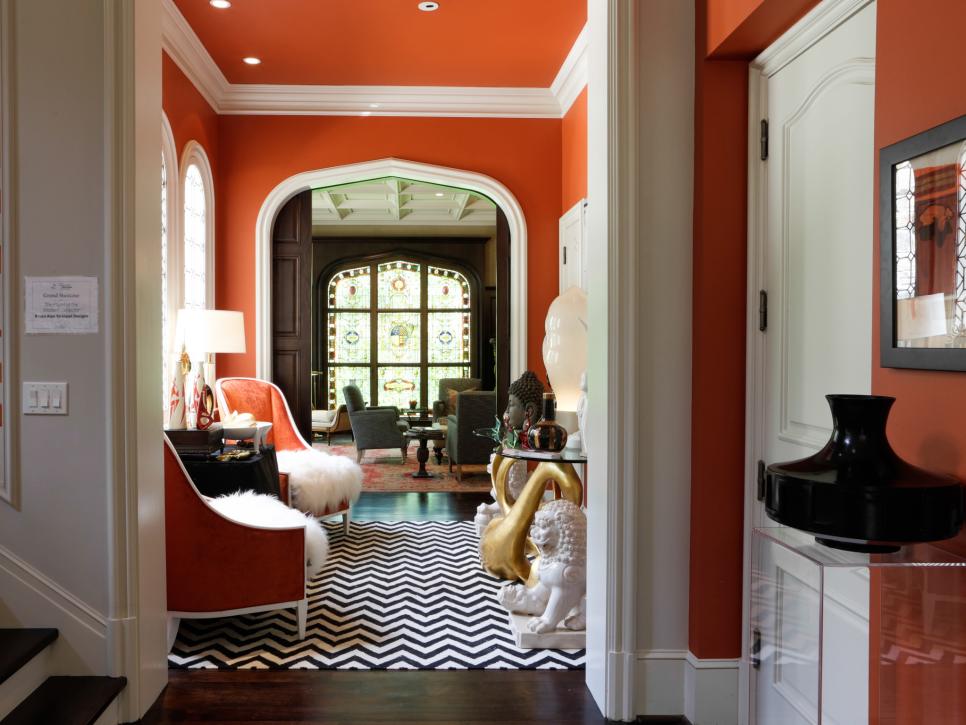 Orange Sunroom With Black & White Chevron Rug and Recessed Lighting