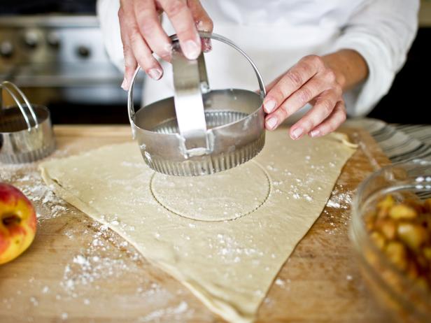 Using larger circular crust cutter, cut a 5-inch circle out of pastry. This will be the outer crust.