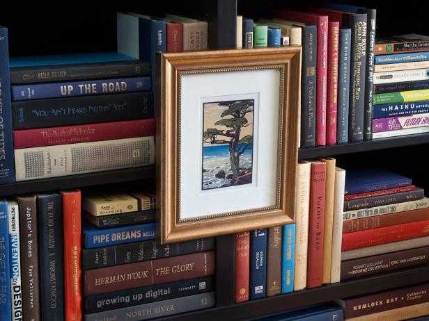 Art in Gilded Frame Featured on Bookcase Edges Art in Gilded Frame Featured on Bookcase Edges