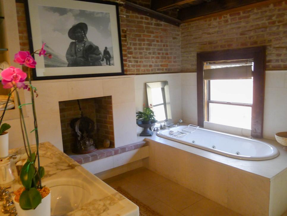 Cream Bathroom with Brick Walls and Oval Bathtub
