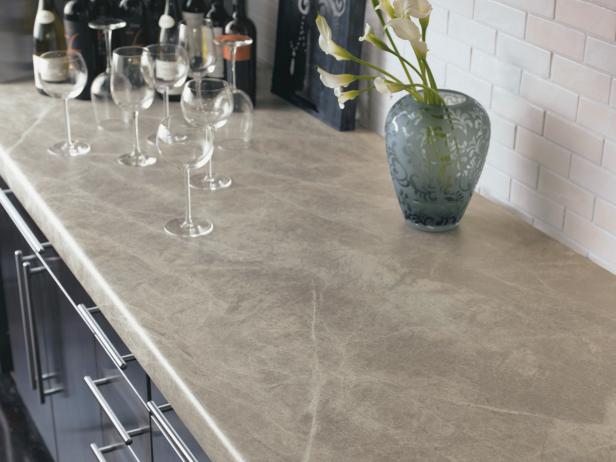 Laminate countertops are an inexpensive, low-maintenance alternative to pricey stone and solid-surface countertops, and they are available in many styles that mimic expensive surfaces such as granite or marble. Laminate countertops are not resistant to heat and can scratch. Image courtesy of Formica Corp.