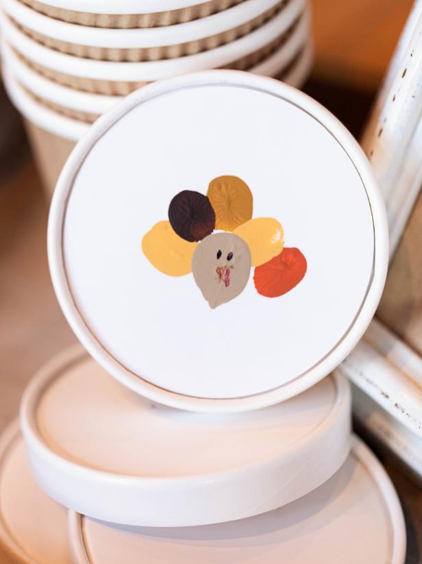 Keep the littlest Thanksgiving guests happily occupied with <a href="http://www.hgtv.com/handmade/thanksgiving-kids-craft-fingerprint-turkey/index.html">this fun craft</a> that allows them to personalize favor cups they can then fill with a custom sweet-and-salty snack mix.