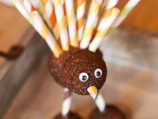 Foam balls, googly eyes, paint and colorful paper straws are all you need to help kids craft these cute turkey decorations for Thanksgiving.