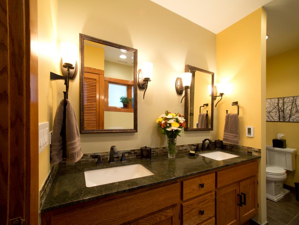 Yellow Bathroom With Wooden Double Vanity & Undermount Sinks